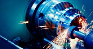 Precision machining of Dana Spicer transmission components with sparks flying.